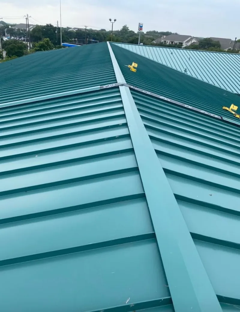 Green commercial metal roof ridge and valley for Metal Roof Repair in Danbury