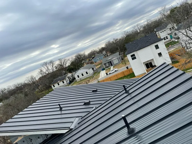 Standing seam metal roof panels with vents for Skylight Repair in Danbury